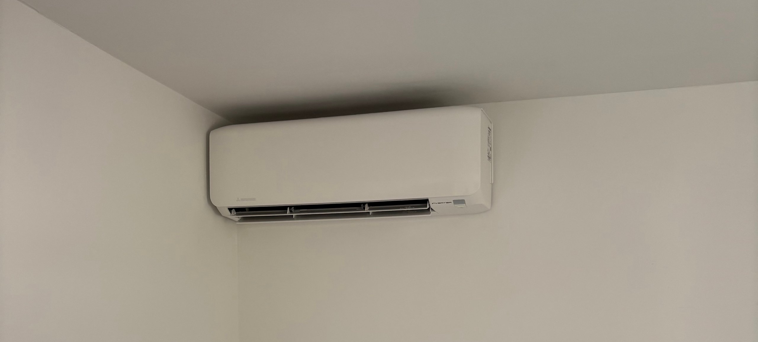 White and black split-type air conditioner unit